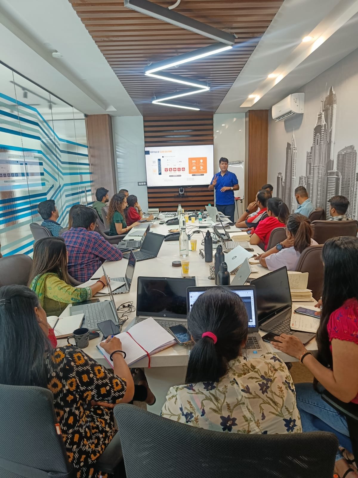 Professional trainer conducting a workshop in a modern classroom setting.
